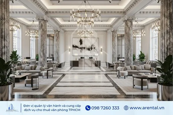 Không gian sảnh văn phòng với đèn chùm, trần cao và nội thất sang trọng.
